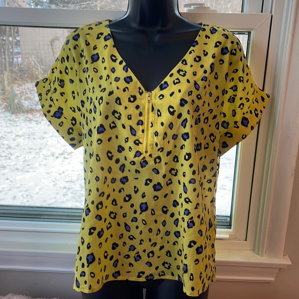 Mello Day yellow shell with purple and black leopard print.